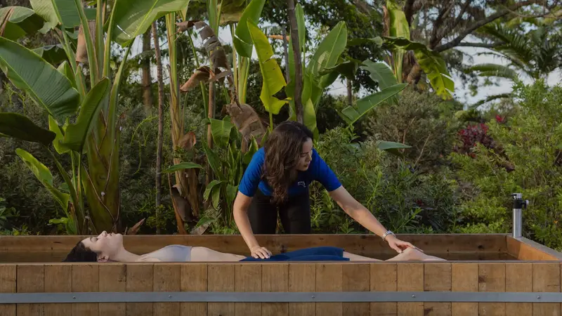 Cold exposure specialist coaching breathing beside an ice bath in Bali