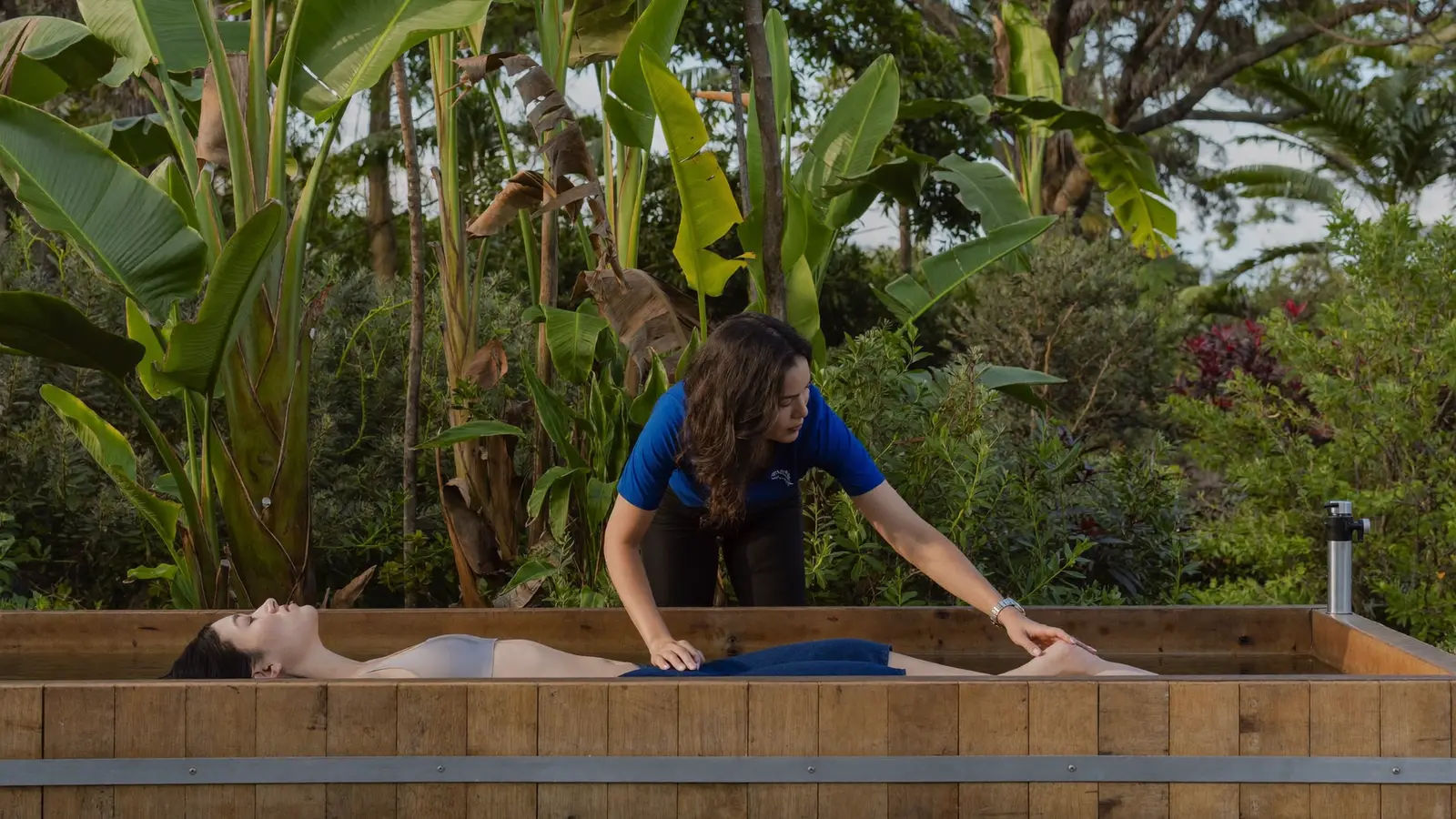 Cold exposure specialist coaching breathing beside an ice bath in Bali