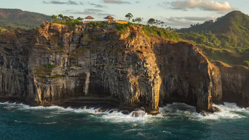 Uluwatu limestone cliffs above the turquoise ocean in Bali