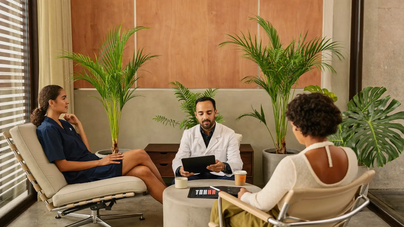 Wellness doctor reviewing a personalized longevity plan with a client in Bali